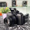 Fujifilm X-T100 front view with XF 50mm f/2 lens attached – entry level mirrorless camera