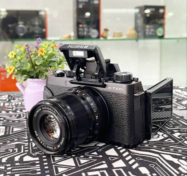 Fujifilm X-T100 front view with XF 50mm f/2 lens attached – entry level mirrorless camera