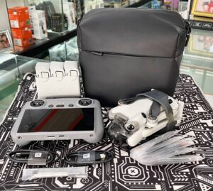 DJI Mini 4 Pro Fly More Combo with RC 2 controller, 3 batteries, and 64GB memory card – like new condition